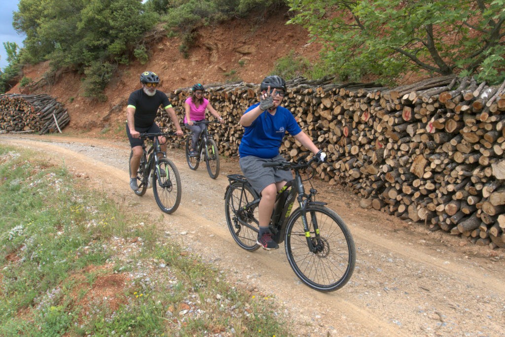 A family of cyclists on ebikes in the region of Mt. Olympus