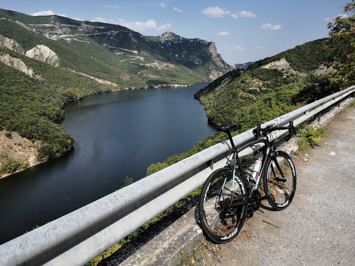 Impresive view of a road bike on Velvendos river during our rides around mountain Olympus