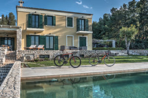 Two road bikes at cycling villa's pool site at Porto Heli