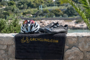 Cycling helemet and cycling shoes at the edge of the villa's balcony