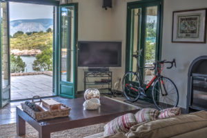 Cycling villa, an interior shot with a road bike in the living room.