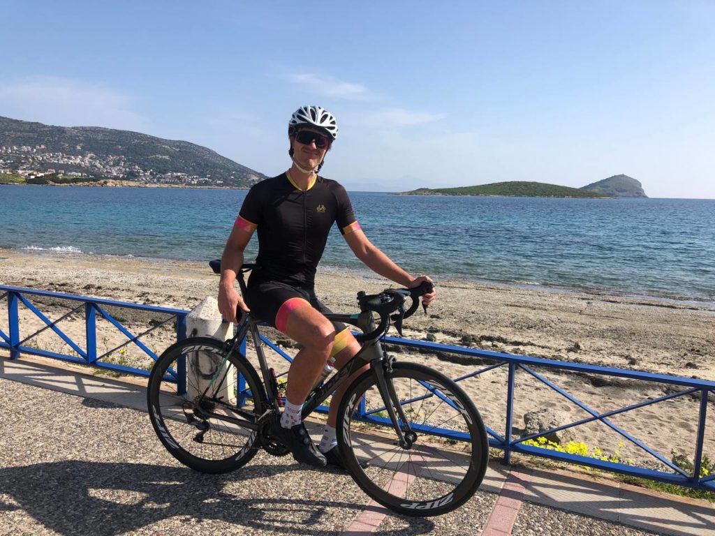 Road cyclist poses in front of the promenade in Athens