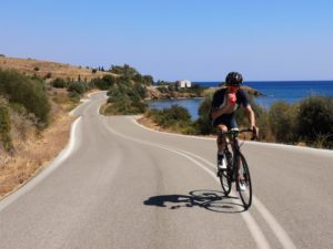 Cyclist is cycling on the last part of the route from Epidaurus to Porto Cheli